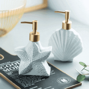 alt="Handmade Ocean-Inspired Starfish Soap Dispenser with Gold Pump" alt="Luxury Ceramic Starfish and Shell Soap Dispenser for Coastal Decor" alt="Eco-Friendly Ocean Themed Soap Dispenser with Embossed Shell and Starfish Patterns"