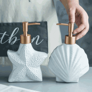 alt="Handmade Ocean-Inspired Starfish Soap Dispenser with Gold Pump" alt="Luxury Ceramic Starfish and Shell Soap Dispenser for Coastal Decor" alt="Eco-Friendly Ocean Themed Soap Dispenser with Embossed Shell and Starfish Patterns"